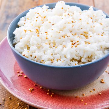 Coconut Rice - Delish.com coconut rice with golden toasted sesame seeds