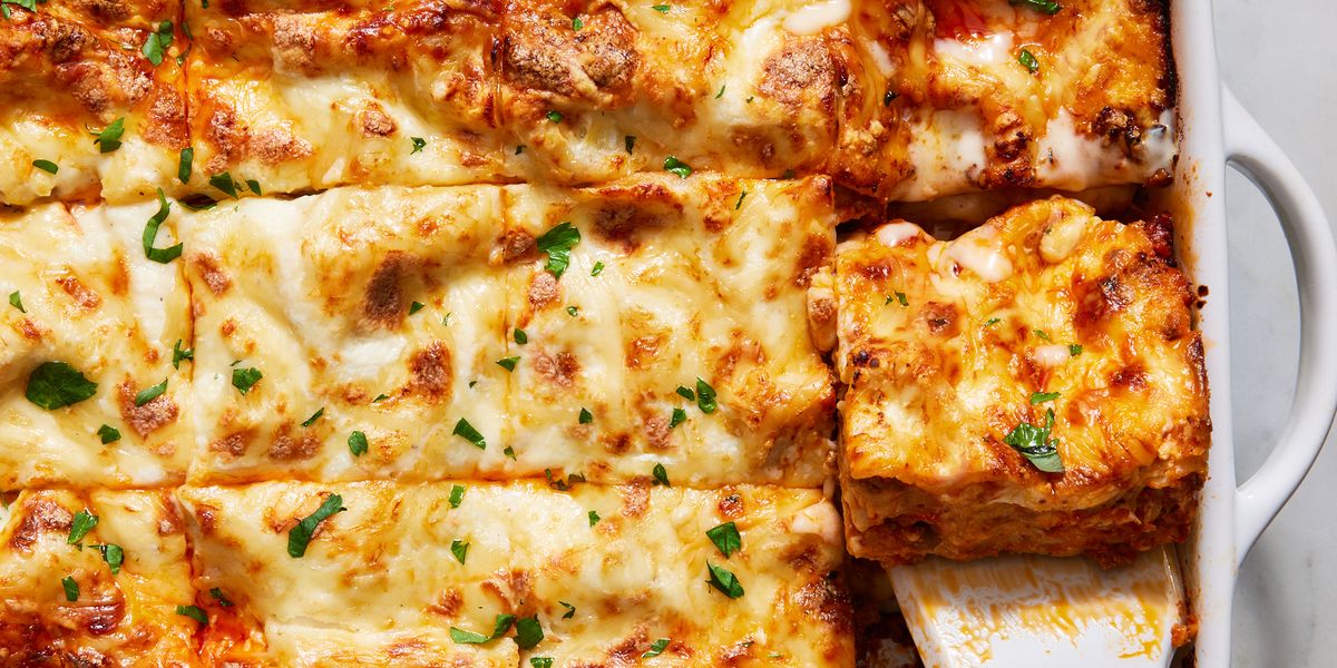 Classic Lasagna classic lasagna in a white pan topped with fresh herbs