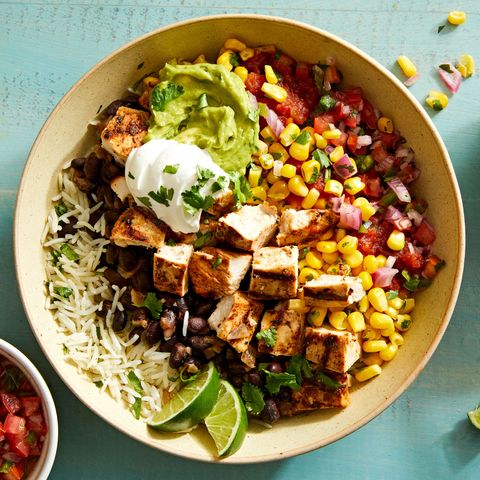 Copycat Chipotle Burrito Bowl copycat chipotle burrito bowl with chicken, guacamole, corn salsa, black beans, and cilantro lime rice