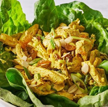 coronation chicken salad in lettuce cups with golden raisins and scallions