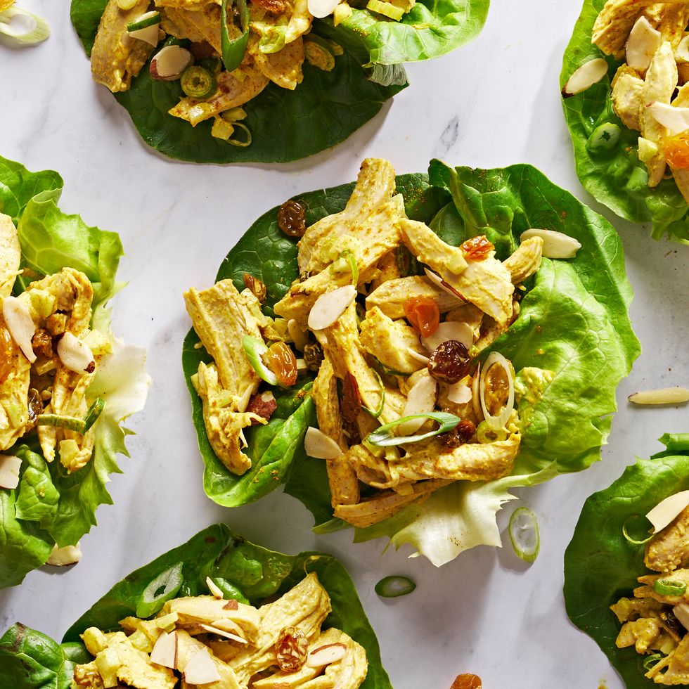 coronation chicken salad in lettuce cups with golden raisins and scallions