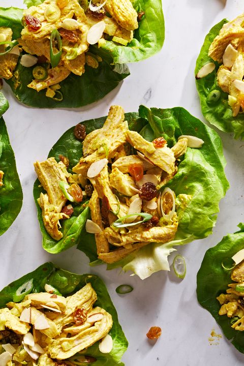 coronation chicken salad in lettuce cups with golden raisins and scallions