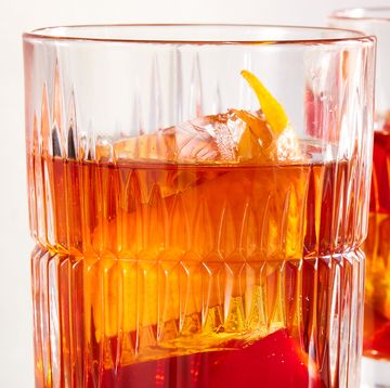 bourbon old fashioned with demerara sugar, bitters, maraschino cherry, and orange peel