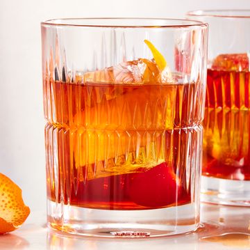 bourbon old fashioned with demerara sugar, bitters, maraschino cherry, and orange peel