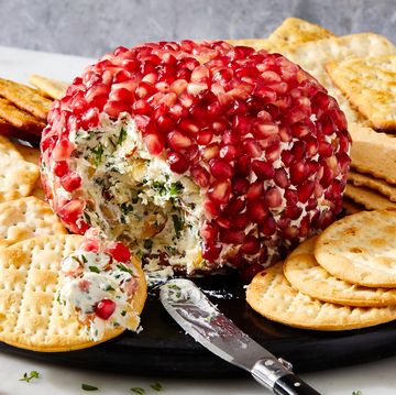 fancy christmas cheese ball covered in fresh pomegranate seeds