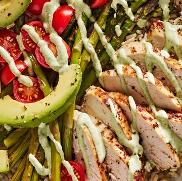 goddess bowls with chicken, asparagus, avocado and tomatoes drizzled with a creamy, green dressing