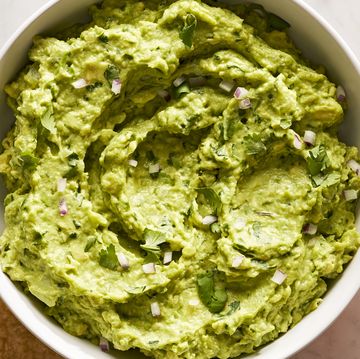 guacamole with diced red onion, cilantro, and with chips