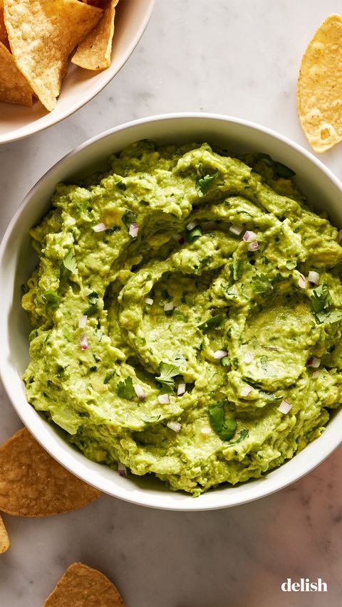 Guacamole guacamole with diced red onion, cilantro, and with chips