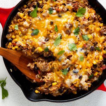 mexican beef 'n rice skillet topped with melty cheese and cilantro