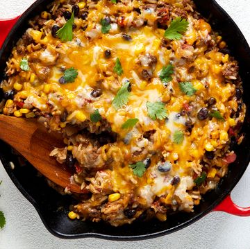 mexican beef 'n rice skillet topped with melty cheese and cilantro