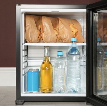 mini bar filled with food and drinks indoors, closeup