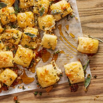 parmesan bread bites topped with sage and hot 
honey