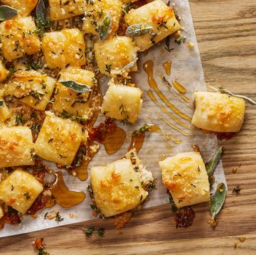 parmesan bread bites topped with sage and hot 
honey