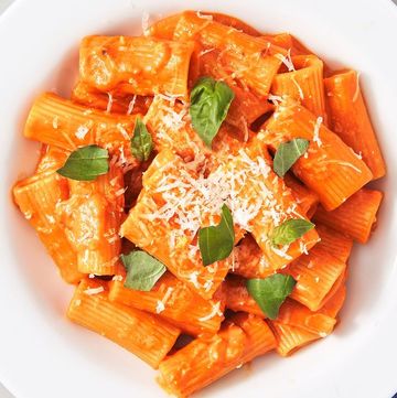 pasta alla vodka garnished with parmesan and torn basil pasta alla vodka garnished with parmesan and torn basil