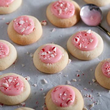 peppermint meltaways cookies topped with pink icing and crushed peppermint cookies