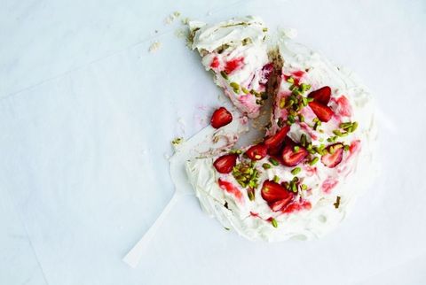 pavlova topped with rhubarb and pistachios
