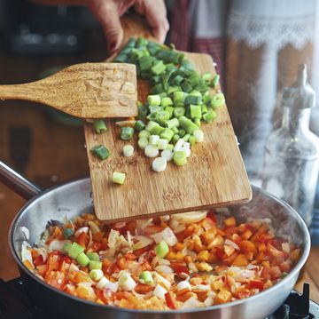 preparing argentinean empanadas with meat and vegetables