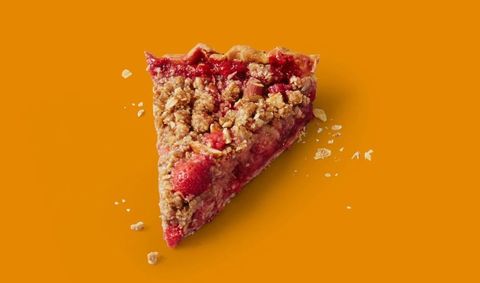 slice of red berry rhubarb pie on a digital orange background slice of red berry rhubarb pie on a digital orange background