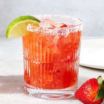 strawberry mezcal margarita with lime and strawberries