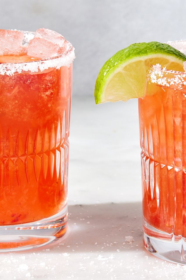 strawberry mezcal margarita with lime and strawberries