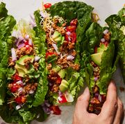 turkey taco lettuce wraps topped with avocado, tomato, red onion, and cilantro